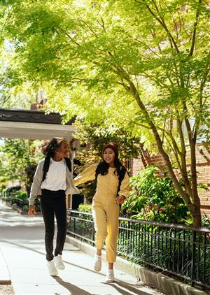 2 girls walking and talking